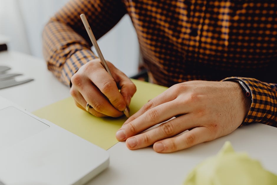 Pet owner writing symptom times and observations for a vet-style home checklist